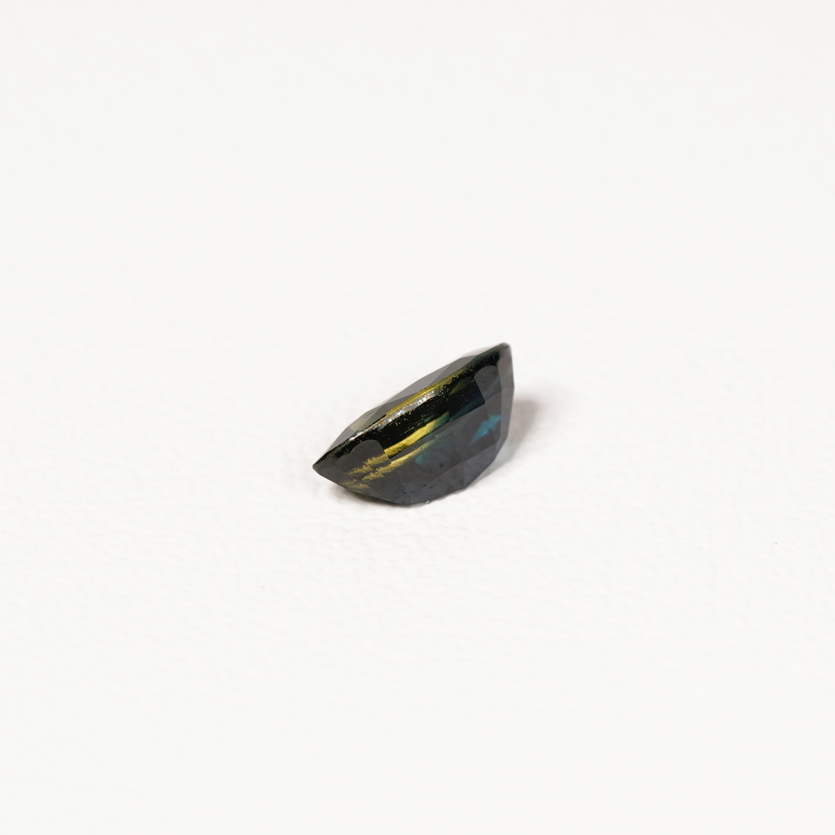 1.95ct Australian parti sapphire marquise — deep inky teal face-up with gold flash, face-up view — Ruhuna Gemstones