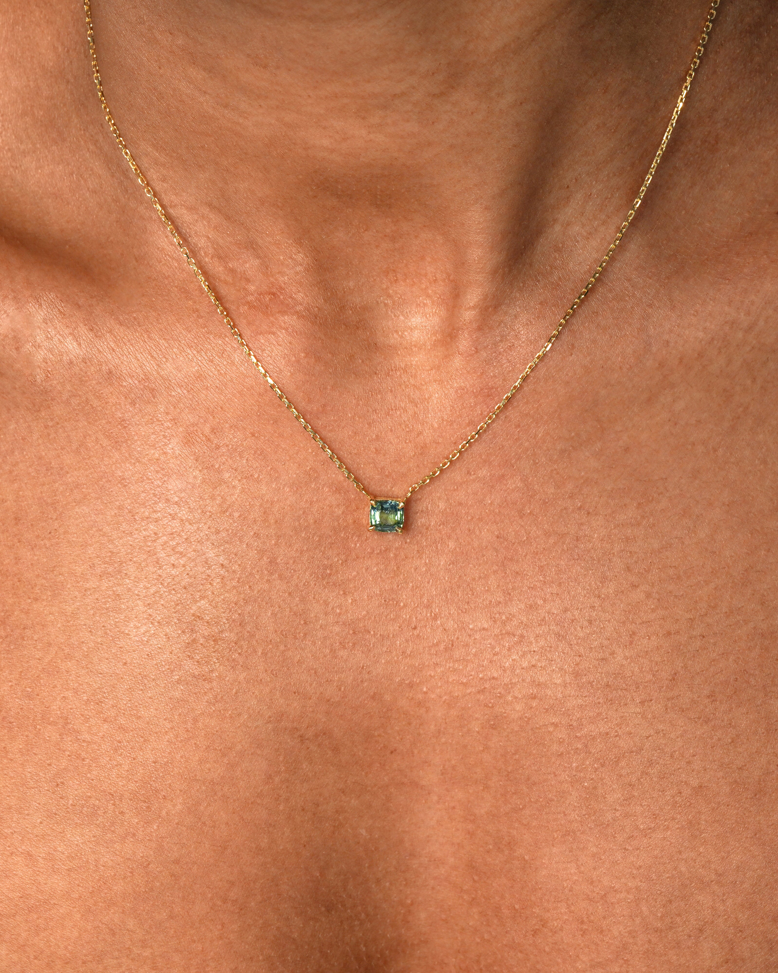 1 carat green teal parti sapphire integrated necklace with double gallery basket in 18ct yellow gold