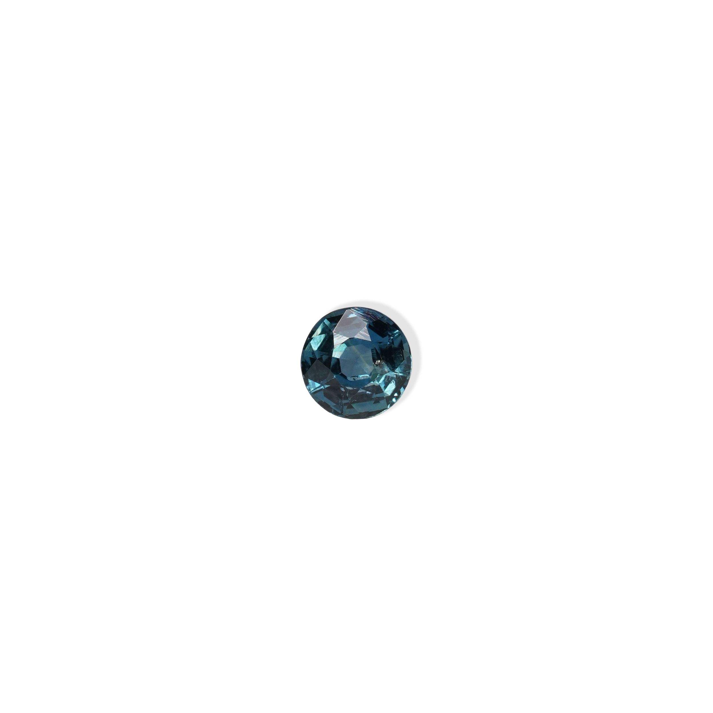 1 carat round parti teal sapphire with mixed green and blue color.