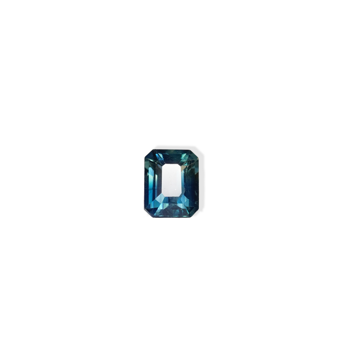 1.1 carat cushion cut parti teal sapphire with mixed green and blue color.