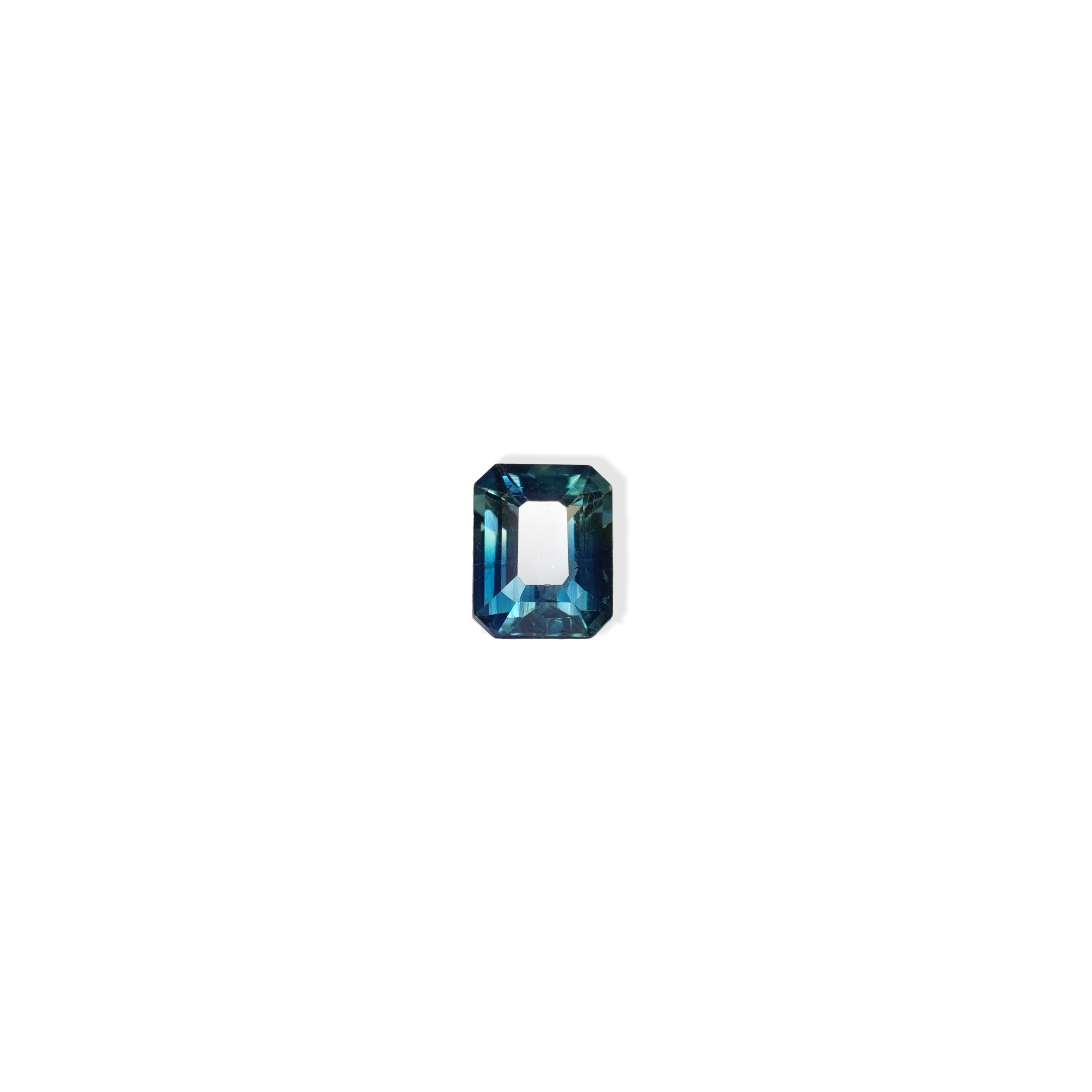1.1 carat cushion cut parti teal sapphire with mixed green and blue color.