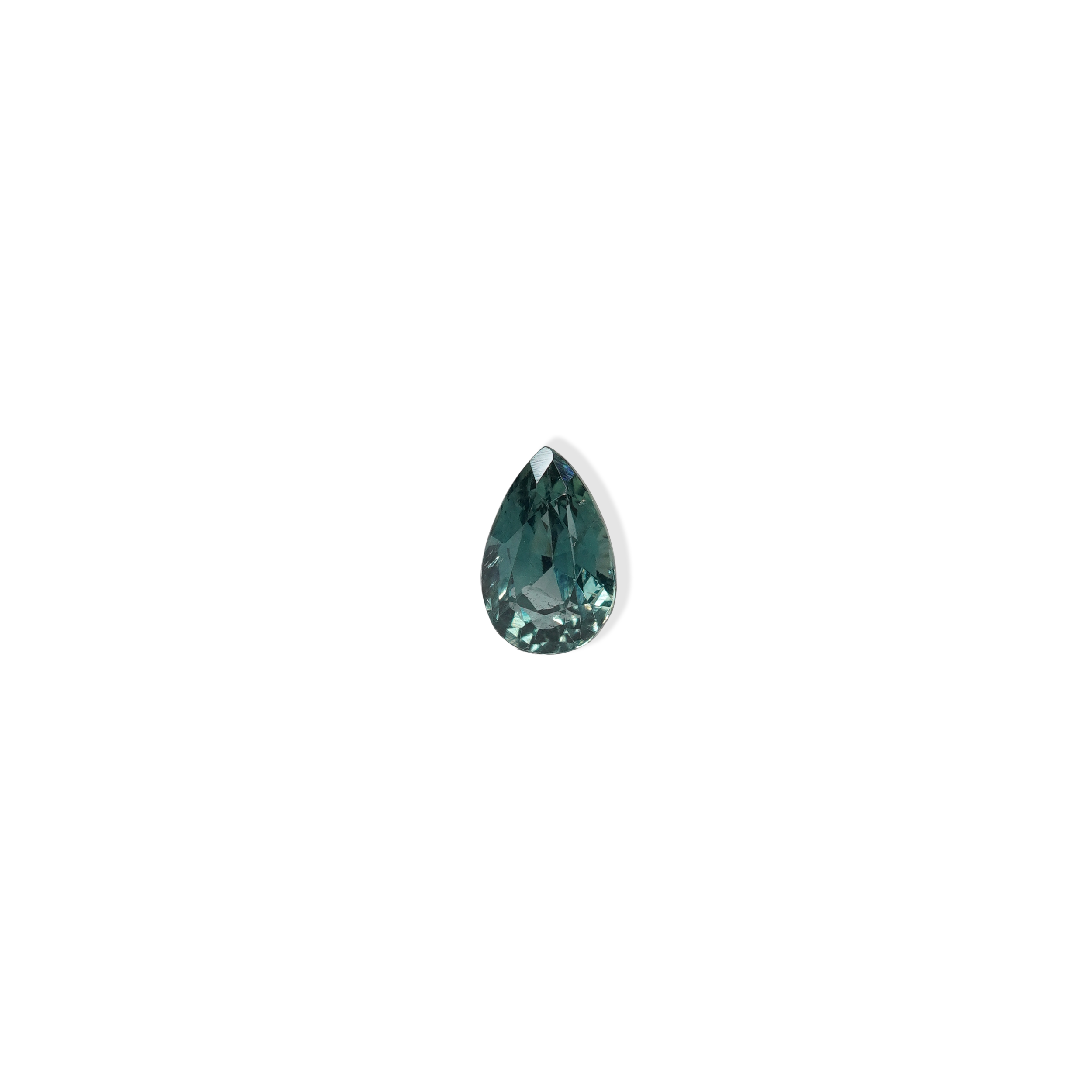 1.1 carat pear parti teal sapphire with mixed green and blue color.