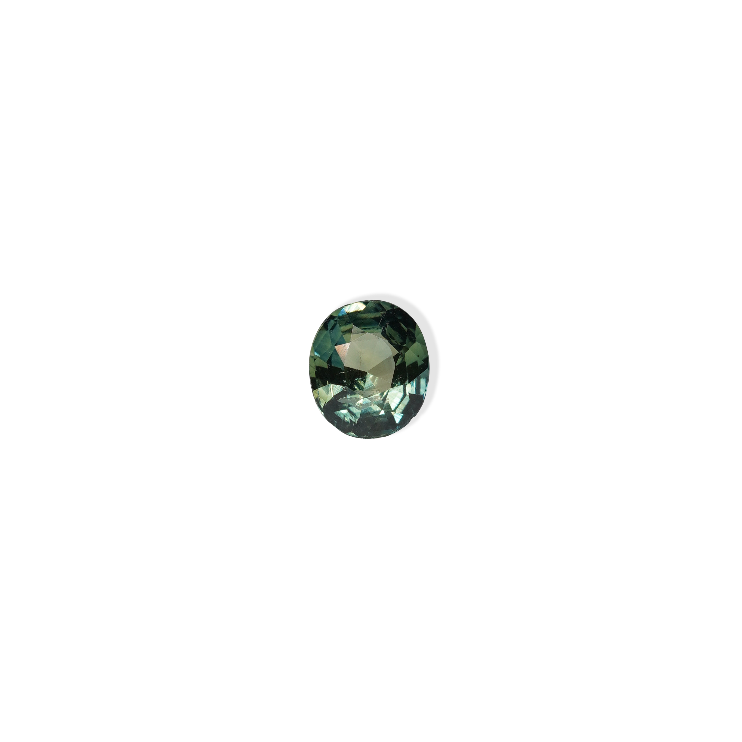 1.3 carat oval parti teal sapphire with mixed green and blue color.