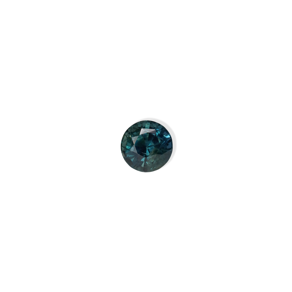 1.76 carat round parti teal sapphire with mixed green and blue color.