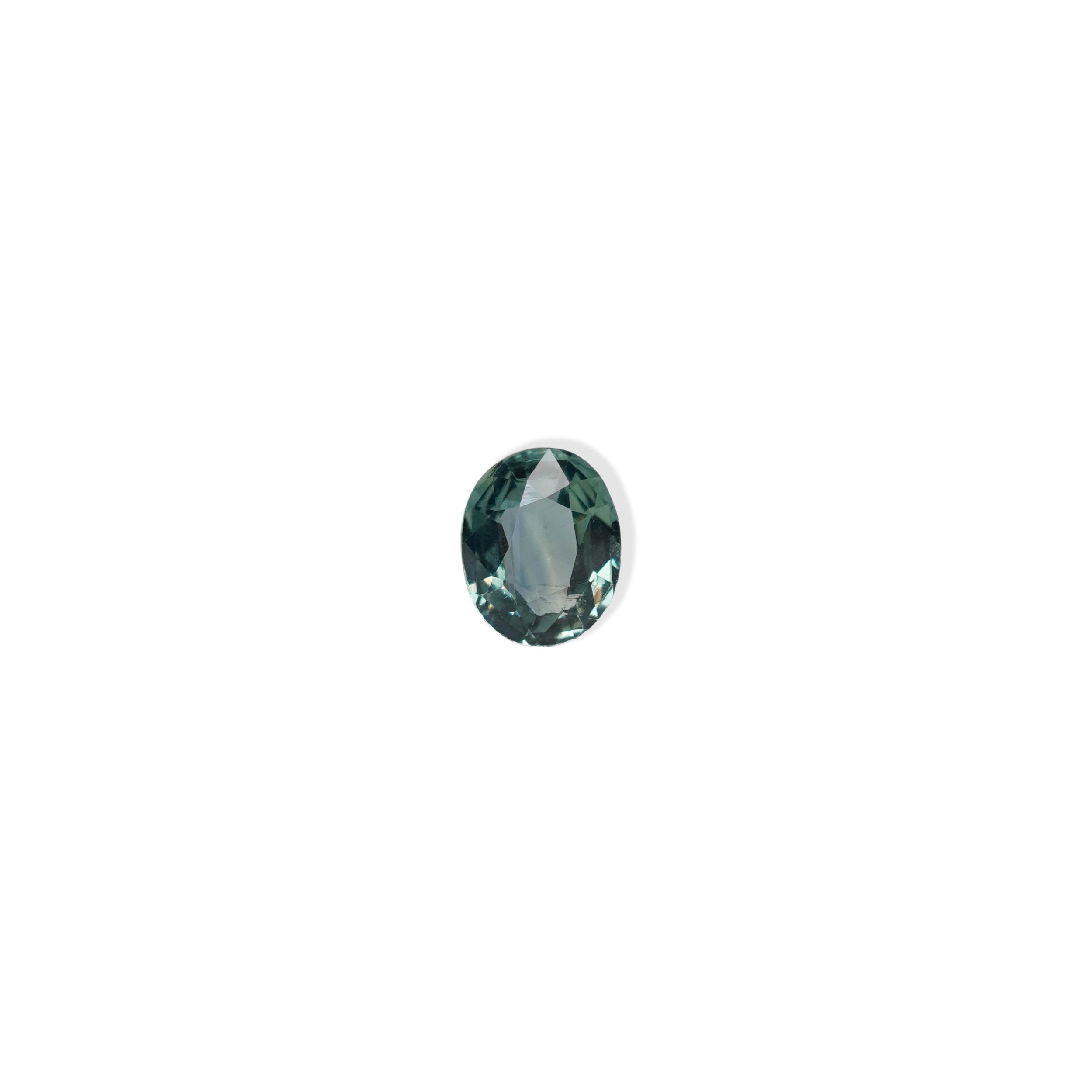 1.10 carat oval parti teal sapphire with mixed green and blue color.