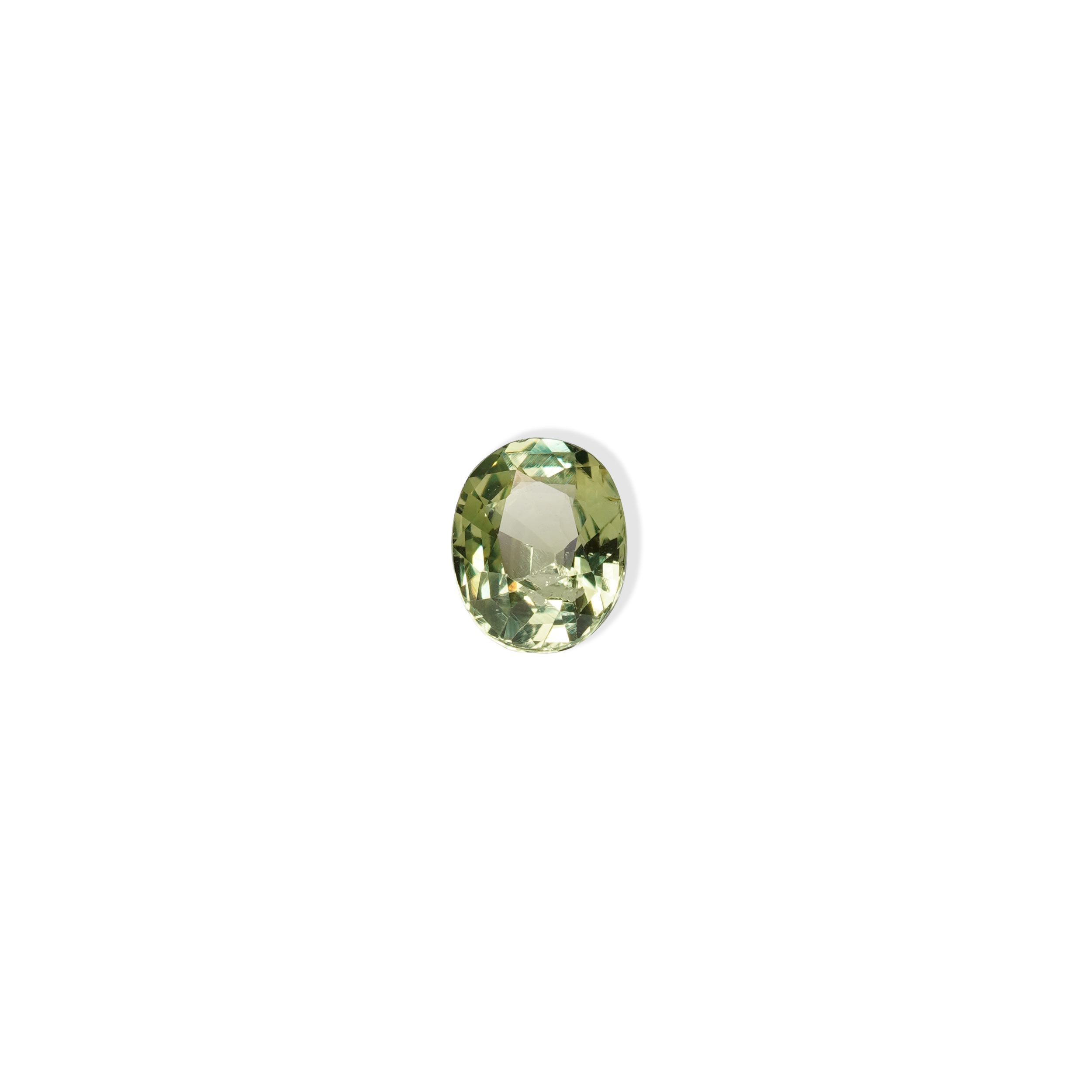 1.30 carat oval parti teal sapphire with mixed green and yellow color.