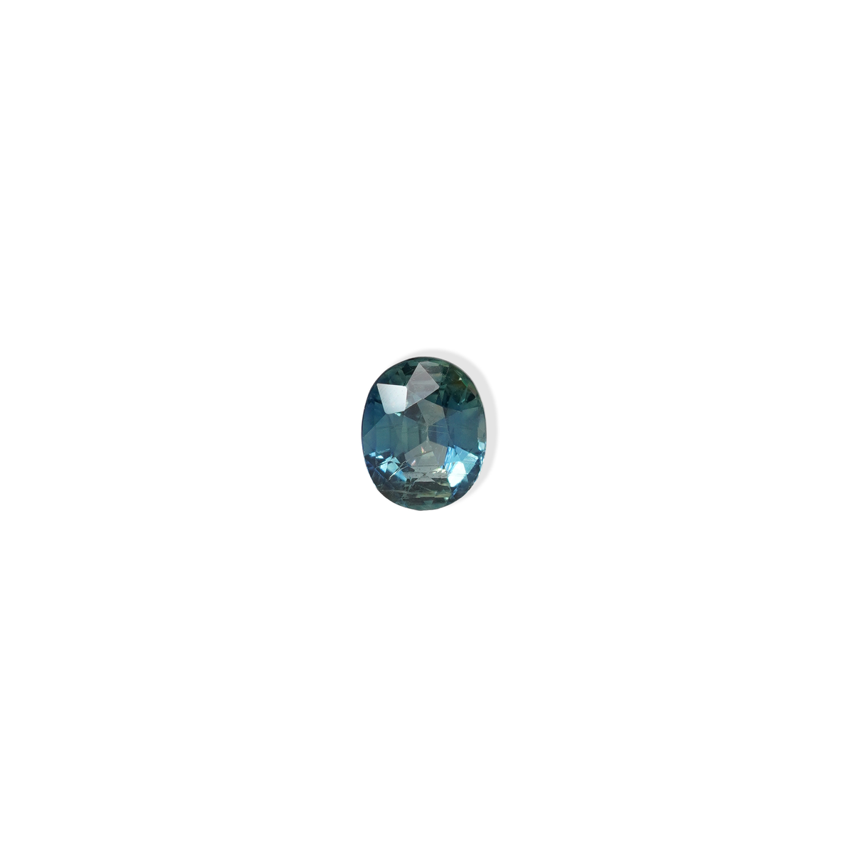 1.25 carat oval parti teal sapphire with mixed green and blue color.