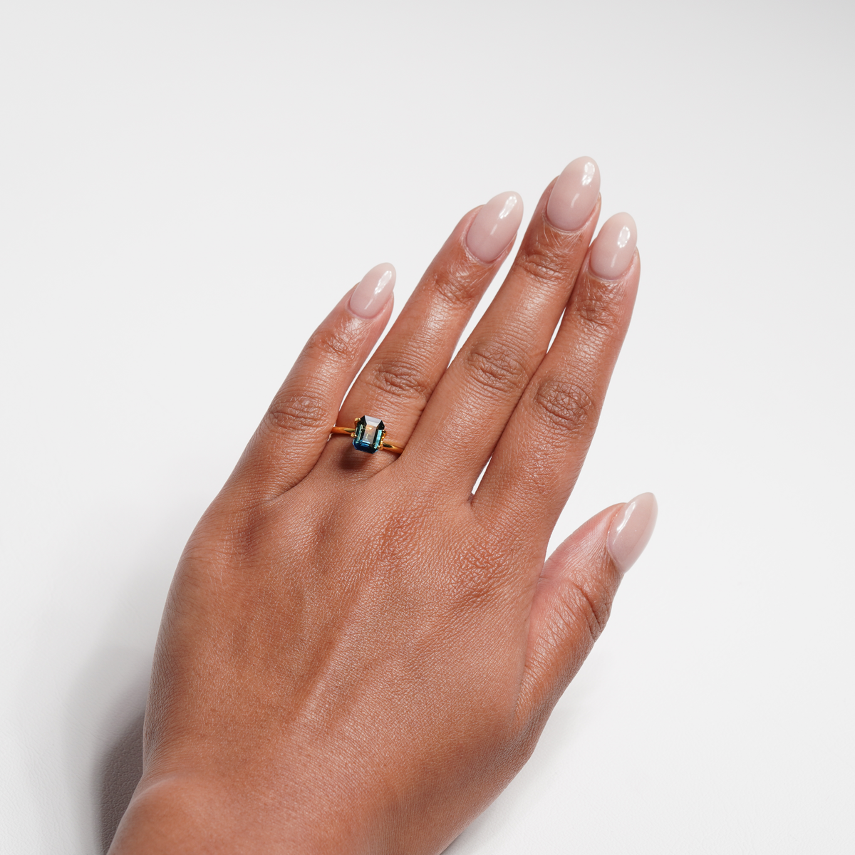 2.02 carat emerald cut teal parti sapphire ring with blue and green
