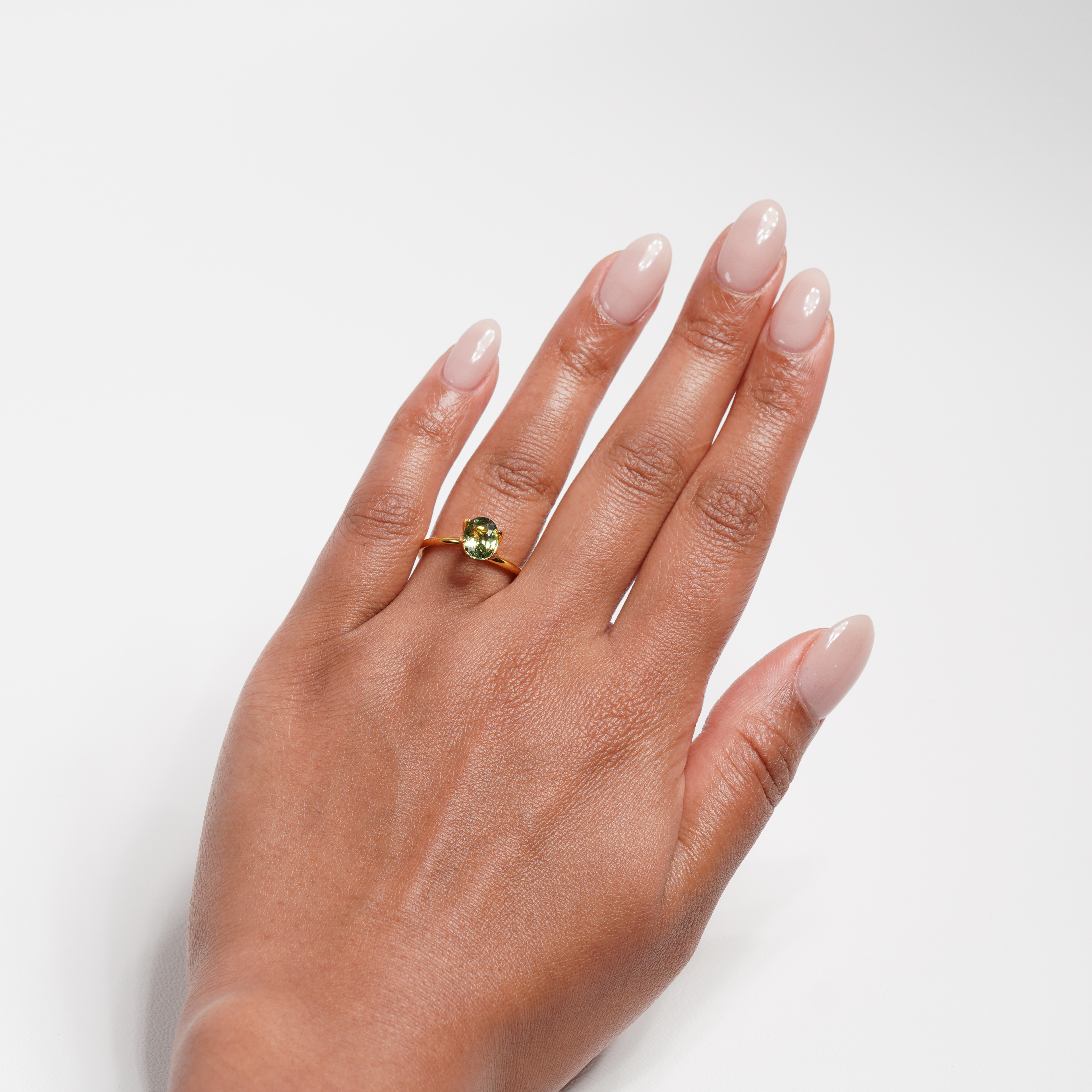 1.30 carat oval parti teal sapphire ring with mixed green and yellow color.