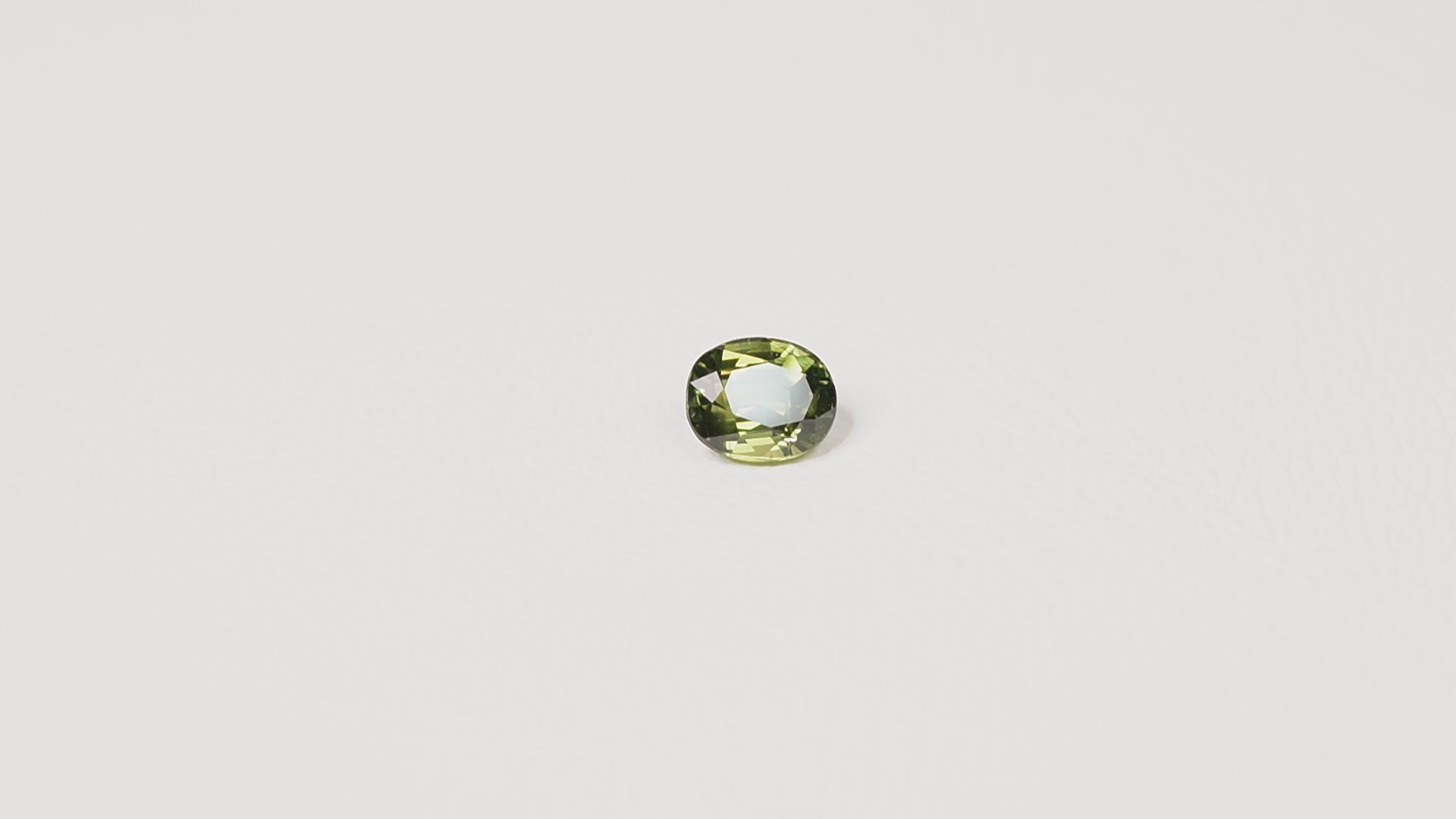 Australian green sapphire 2.10ct oval — saturated green colour zoning at angle — Ruhuna Gemstones