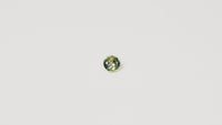 0.90ct Australian parti sapphire round — bright yellow-green body with teal crown accent, face-up — Ruhuna Gemstones