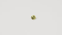 0.95ct Australian yellow-green sapphire round brilliant — vivid lime yellow-green, face-up view — Ruhuna Gemstones
