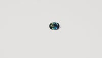  1.25ct Australian parti sapphire oval — deep teal with copper flash through table, face-up — Ruhuna Gemstones