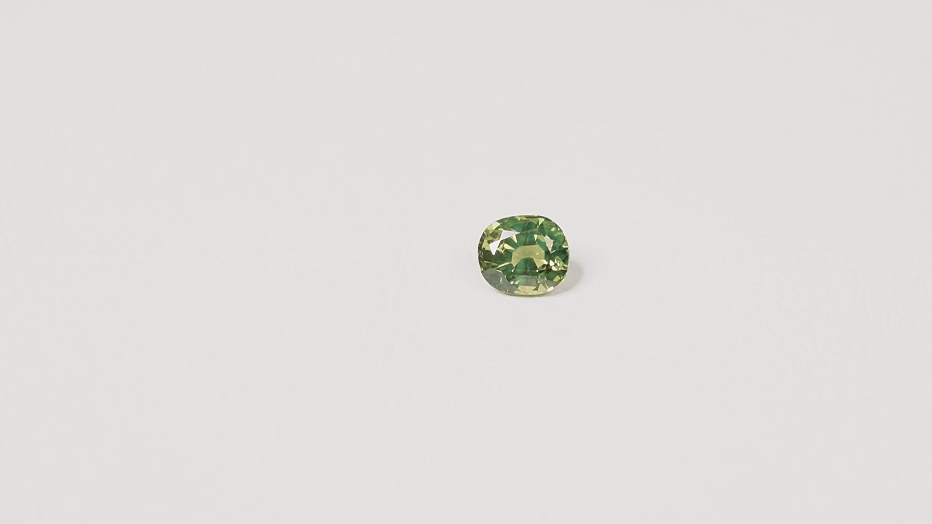 1.70ct Australian parti sapphire cushion — yellow-green centre with forest green crown, face-up — Ruhuna Gemstones