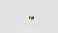 0.90ct Australian parti sapphire oval — golden yellow and teal-green colour zones, face-up — Ruhuna Gemstones