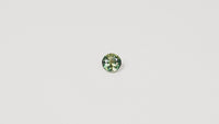 Australian parti sapphire 1.25ct — teal and yellow-green zoning visible at angle — Ruhuna Gemstones