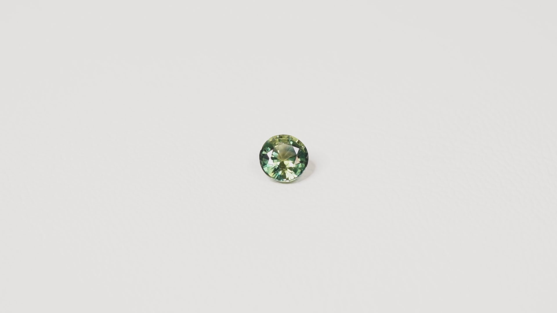 Australian parti sapphire 1.25ct — teal and yellow-green zoning visible at angle — Ruhuna Gemstones