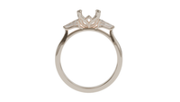 lotus setting trilogy sapphire engagement ring with tapered baguette diamonds in 18ct rose gold