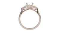 lotus setting trilogy sapphire engagement ring with pear cut diamonds in 18ct rose gold