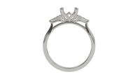 lotus setting trilogy sapphire engagement ring with tapered baguette diamonds in 18ct white gold