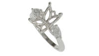 lotus setting trilogy sapphire engagement ring with pear cut diamonds in 18ct white gold