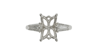 lotus setting trilogy sapphire engagement ring with tapered baguette diamonds in platinum